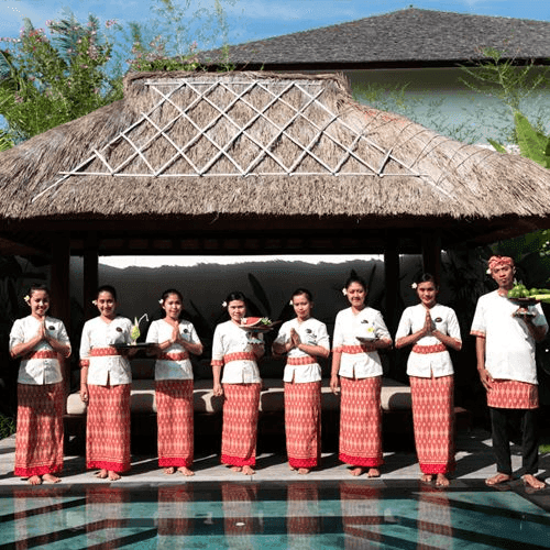 Anam Villa's manager greeting guests with a welcome drink