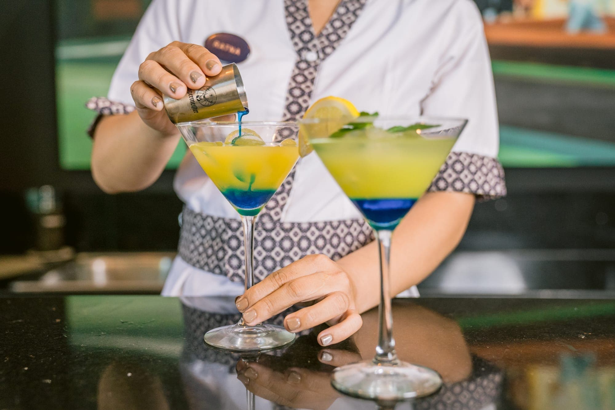 A bartender preparing signature cocktails at Anam Villa