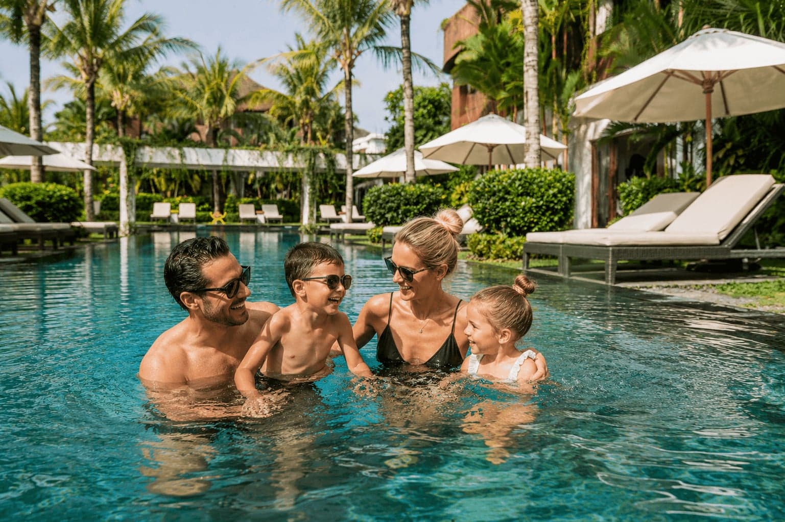 A guest swimming in Anam Villa's private pool