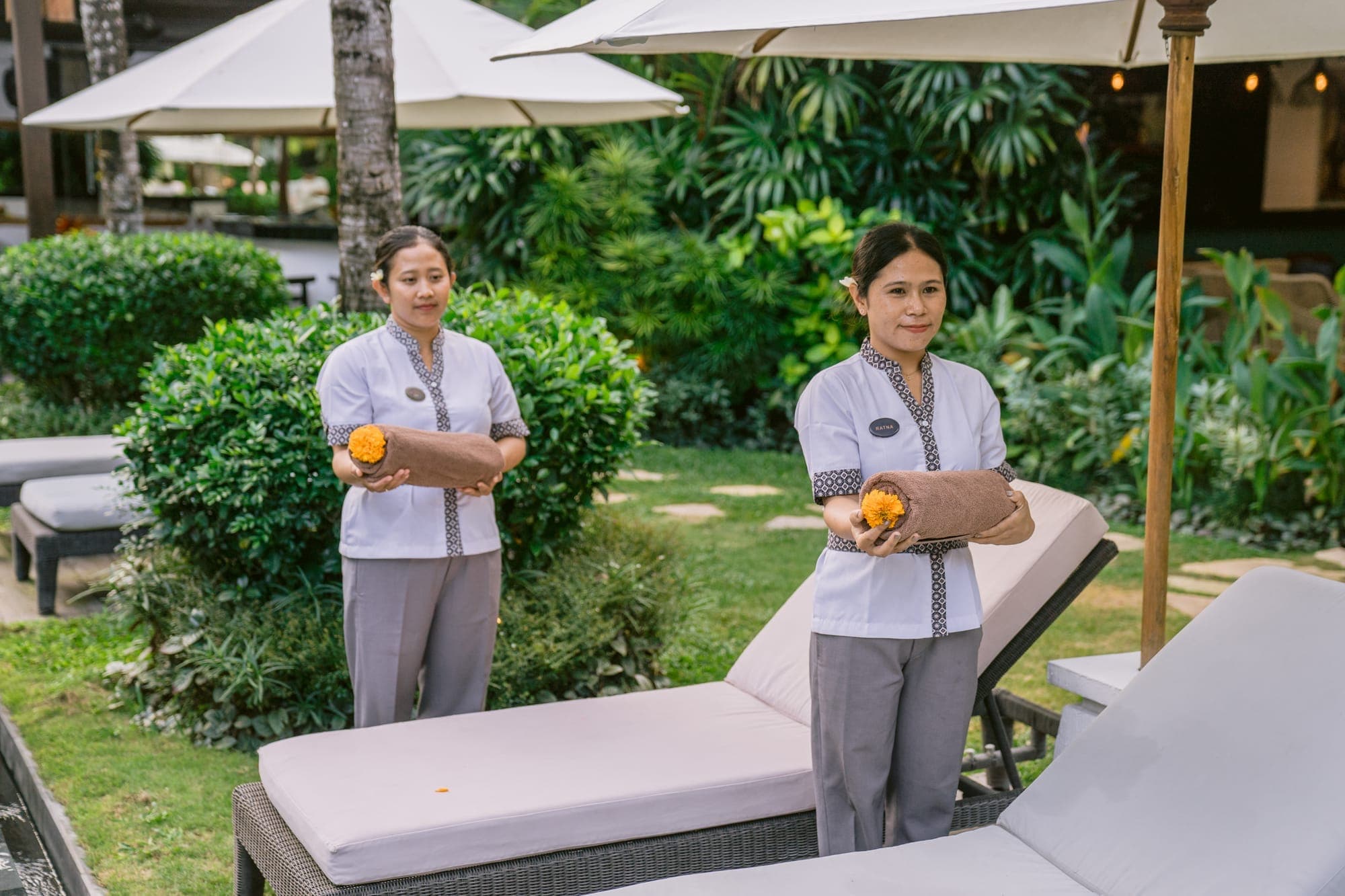 Anam Villa's manager greeting guests with a welcome drink