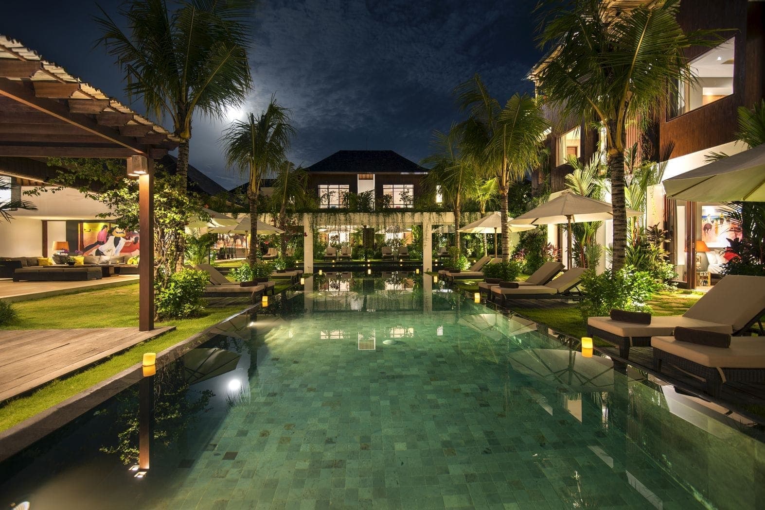 Sun loungers beside Anam Villa's pools