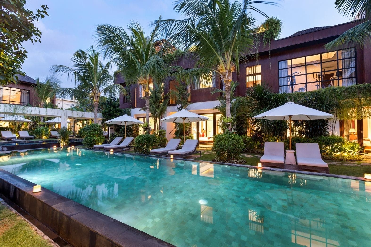 Sun loungers along the mirror pool at Anam Villa